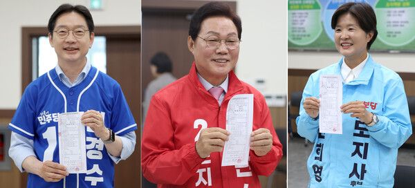경남지사에 출마한 후보들이 14일 경남도선거관리위원회에서 후보 등록을 마친 후 사진 촬영을 하고 있다. 왼쪽부터 민주당 김경수 후보, 국민의힘 박완수 후보, 진보당 전희영 후보(기호순). [연합뉴스]