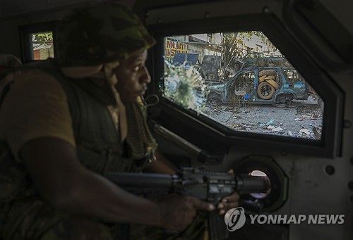 아이티 포르토프랭스 지역 순찰하는 유엔 지원 케냐 경찰
