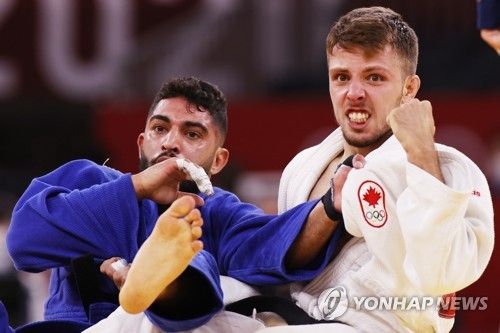 도쿄 올림픽에 출전했던 이스라엘 유도 국가대표 토하르 부트불(왼쪽)