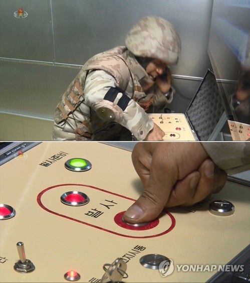 화성-17형 ICBM 발사 버튼 누르는 북한군