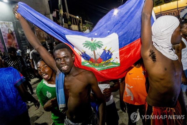 18일(현지시간) 월드컵 본선 진출 축하하는 아이티 주민들