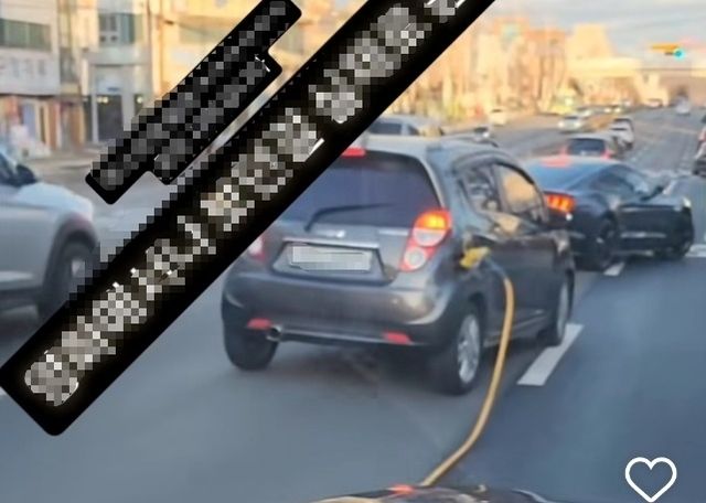 주유건 꽂은 채 주행하는 차량