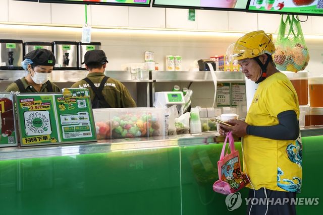 중국 베이징의 메이퇀 배달 기사