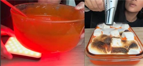 물엿에 빨간색 식용 색소를 넣고, 마시멜로 겉을 태워 '용암'을 만드는 모습