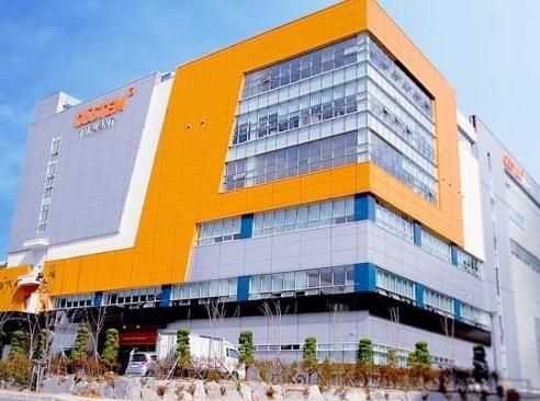 부산광역시 해운대구 석대첨단산업단지에 위치한 오스템임플란트 K1 공장(오렌지타워) [오스템임플란트 제공]