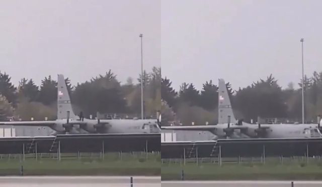 미군 수송기에 올라탄 검은 복장의 남성