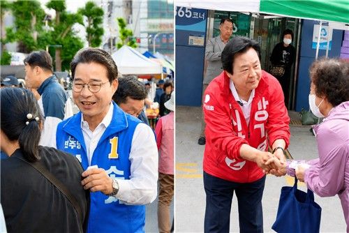 유권자와 인사 나누는 민주 송순호(왼쪽)·국힘 강기윤