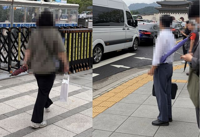 우산을 가로로 들고 다니는 행인들
