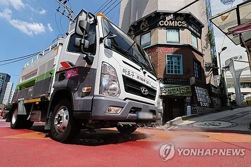 더위 식히는 살수차