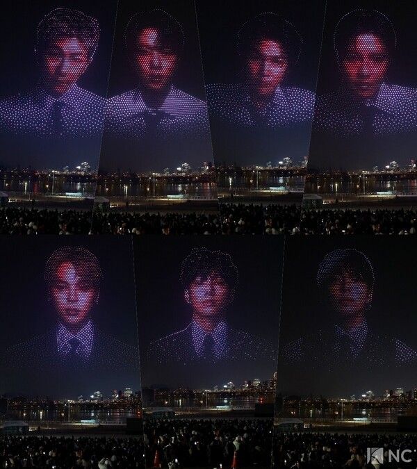 A drone show unfolds over Ttukseom Hangang Park in Gwangjin-gu, Seoul, on March 20 to celebrate BTS’s full-group comeback. Photo by Kim Gyubin.