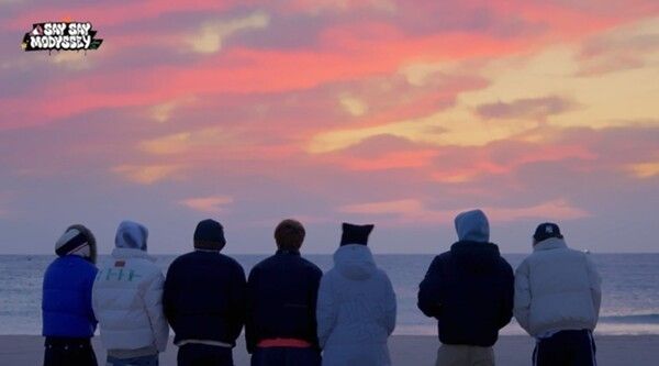 MODYSSEY members reflect on their debut at sunrise. Photo by Mnet.