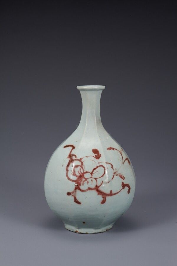 White porcelain octagonal bottle with copper-red peony design. Photo by National Museum of Korea.