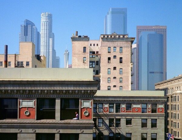 ©Wim Wenders, Woman in the Window, Los Angeles, USA, 1999, from Two Pairs of Eyes: Photographs by Donata and Wim Wenders, Ernst Leitz Museum, Wetzlar, 2026. Photo courtesy of Leica Camera Korea.