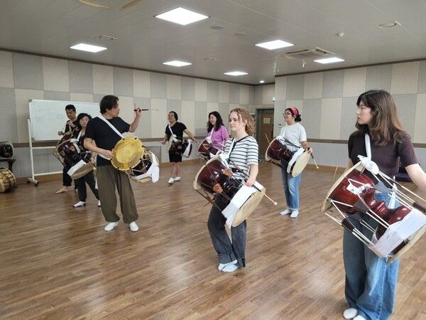 Participants take part in a traditional Korean dance workshop during the international training program. Photo courtesy of the National Gugak Center.