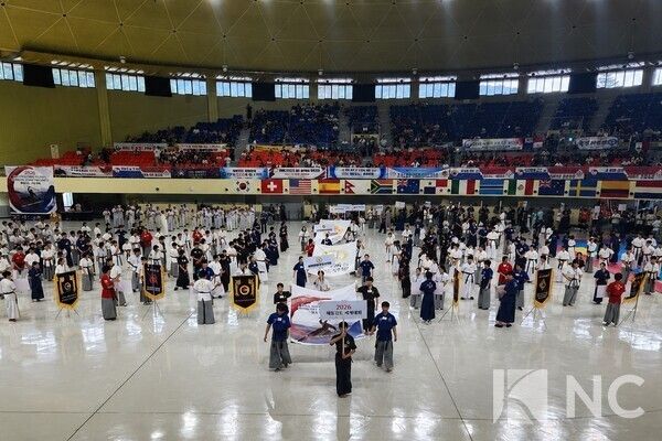 National teams and flag bearers enter Pyeongchang Dome Gymnasium during the opening ceremony, marking the official start of the 14th Haidong Gumdo World Championship. Photo courtesy of News Culture DB