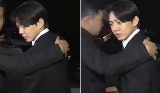 지난 24일 구속영장기각 결과를 받아 들고 돌아가는 길 한 시민이 던진 페트병에 맞은 뒤를돌아보는 유아인.ⓒ연합뉴스TV 보도화면 갈무리