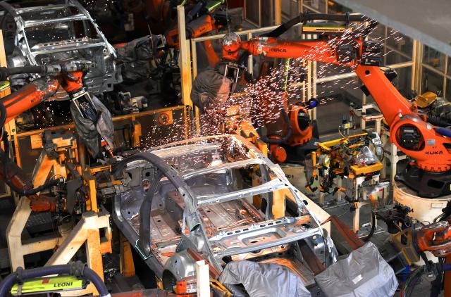 Robot arms assemble vehicles on a production line at a FAW-Volkswagen factory in Qingdao Shandong province on Jan 27 2026 AFP-Yonhap