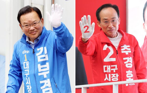 &nbsp;더불어민주당&nbsp;김부겸&nbsp;대구시장 후보(왼쪽)와 국민의힘&nbsp;추경호&nbsp;대구시장 후보가 21일 대구 범어네거리와 반월당사거리에서 출근길 인사를 하고 있다. [사진=연합뉴스]