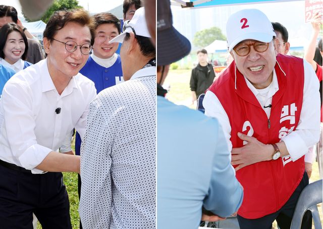 전재수(왼쪽) 더불어민주당 부산시장 후보와 박형준 국민의힘 부산시장 후보가 25일 부산 강서구 대저생태공원 파크골프장에서 열린 부산어르신파크골프축제에 참석, 참가자들과 인사하며 지지를 호소하고 있다. [사진제공=뉴시스]