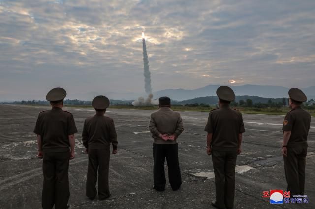 In this file image North Korean Kim Jong-un center inspects a test launch of a Hwasong-11da-45 a ballistic missile with a super-large 45-ton warhead on September 18 KCNA Yonhap