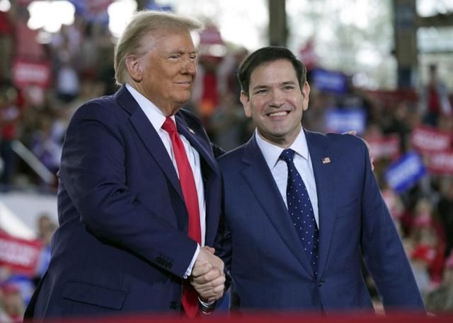 Then-Republican presidential nominee Donald Trump left greets senator Marco Rubio during a campaign rally in Raleigh North Carolina on Nov 4 2024 AP-Yonhap