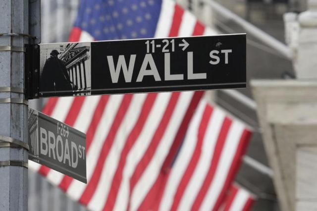 Signs marking the intersection of Broad and Walls streets appear near the New York Stock Exchange in New York on Oct 1 2024 AP-Yonhap 