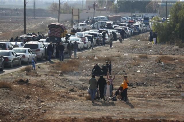 Lebanese families sit in traffic as they return to Lebanon through the Jousieh border crossing Syria on Nov 28 2024 following a ceasefire between Israel and Hezbollah AP-Yonhap