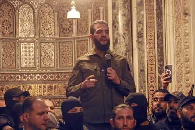 Abu Mohammed al-Golani speaks at the Umayyad Mosque in Damascus on Dec 8 2024 AP-Yonhap 