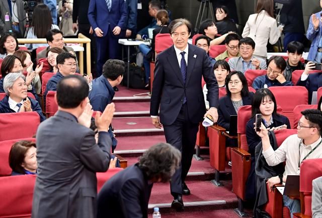 The Rebuilding Korea Party leader Cho Kuk enters the partys election monitoring room after joint exit poll results were unveiled by major broadcasters on April 10 JOINT PRESS CORPS
