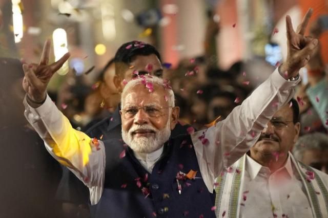 Prime Minister Narendra Modi greets supporters as he arrives at Bharatiya Janata Party BJP headquarters in New Delhi India on June 4 2024 AP-Yonhap