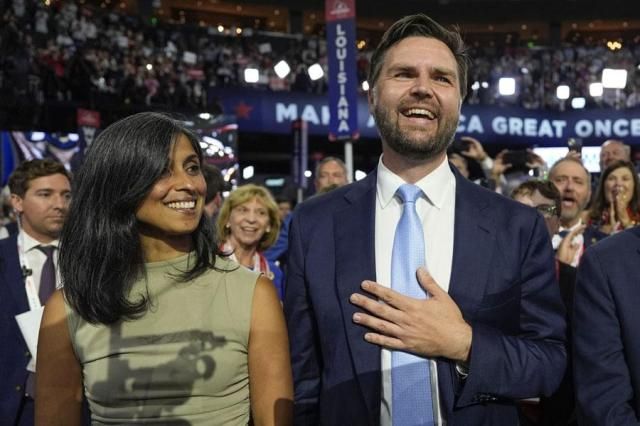 Republican vice presidential candidate Sen JD Vance R-Ohio and his wife Usha Chilukuri Vance arrive on the floor during the first day of the 2024 Republican National Convention at the Fiserv Forum in Milwaukee on July 15 2024 AP-Yonhap