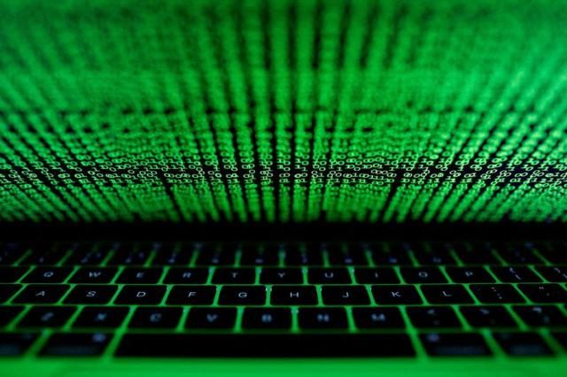 A computer keyboard lit by a displayed cyber code is seen in this illustration picture taken on March 1 2017 Reuters-Yonhap
