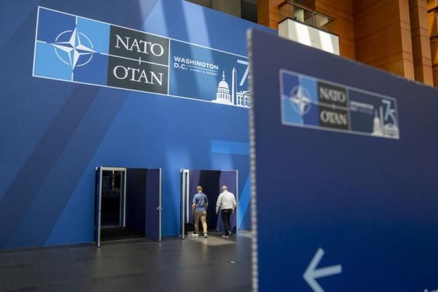 People walk inside of the Walter E Washington Convention Center which has been decorated with signage in preparation for the NATO Summit on July 8 2024 AP-Yonhap
