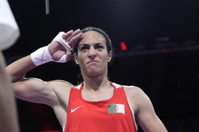 Algerias Imane Khelif celebrates after defeating Hungarys Anna Hamori in their womens 66-kg quarterfinal boxing match at the Summer Olympics in Paris France on Aug 3 2024 AP-Yonhap