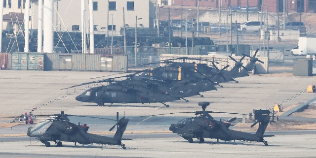One day before the start of the regular US-South Korea joint military exercise Freedom Shield Apache helicopters and other military assets are on standby at Camp Humphreys in Pyeongtaek Gyeonggi Province on Sunday Yonhap