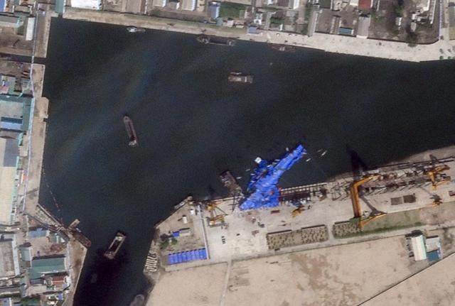 A North Korean destroyer is covered with a blue tarp after an accident during its launch at a shipyard in Chongjin North Hamgyong Province on May 23 2025 in this satellite image from Planet Labs