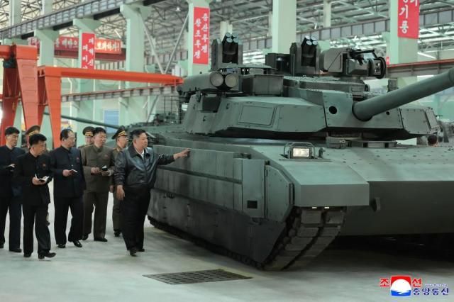 Kim Jong-un Chairman of North Korea’s State Affairs Commission inspects a tank factory during a field guidance visit KCNAYONHAP