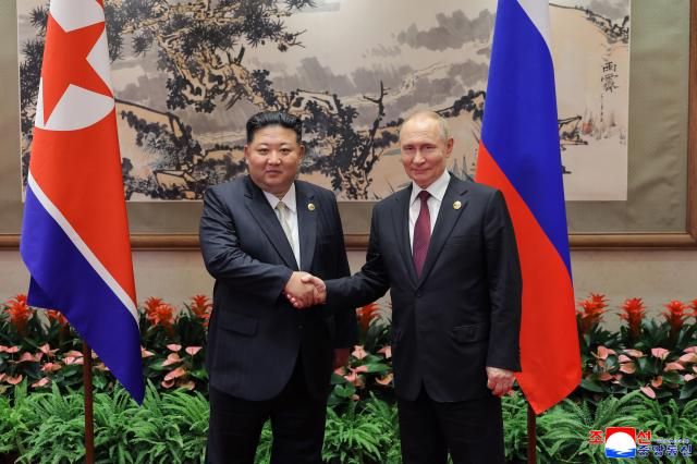 Kim Jong-un left and Russian President Vladimir Putin right held talks at Beijing’s Diaoyutai State Guesthouse on Sept 3 during Kim’s visit to attend China’s 80th Victory Day military parade in this photo released by the official North Korean Central News Agency the following day Yonhap