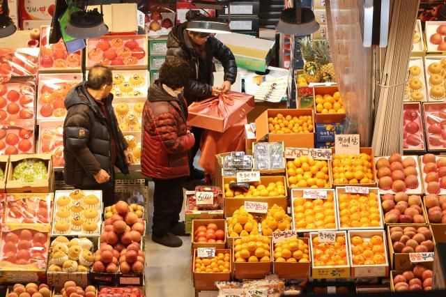 A vendor packages gift sets at Namchon Agricultural and Marine Products Wholesale Market in Incheon Feb 13 2026 AJP Han Jun-gu