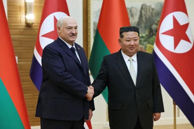 Belarusian President Alexander Lukashenko left shakes hands with North Korean leader Kim Jong-un during a meeting in Pyongyang on March 26 2026 Reuters-Yonhap