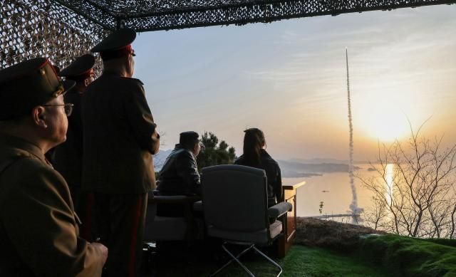 North Korean leader Kim Jong-un along with his daughter Ju-ae watches the test-firing of missiles at an undisclosed location in North Korea on April 19 2026 in this photo released by the state-run North Korean Central News Agency the following day