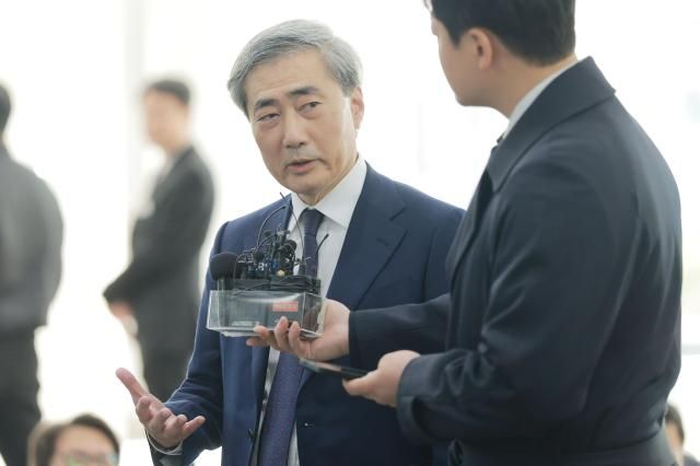 Bank of Korea governor nominee Shin Hyun-song speaking to the press as he reports to his interim office to prepare for a confirmation hearing March 31 2026 Aju Business Daily