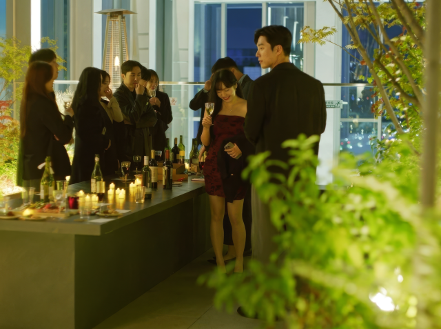Participants mingle over wine at The Grace Club’s premium Black Party in Yeongdeungpo Seoul on April 18 2026 Courtesy of The Grace Club
