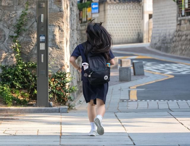 A student is running to school in Seoul’s Jongno district on Teachers’ Day May 15 2026 AJP Yoo Na-hyun