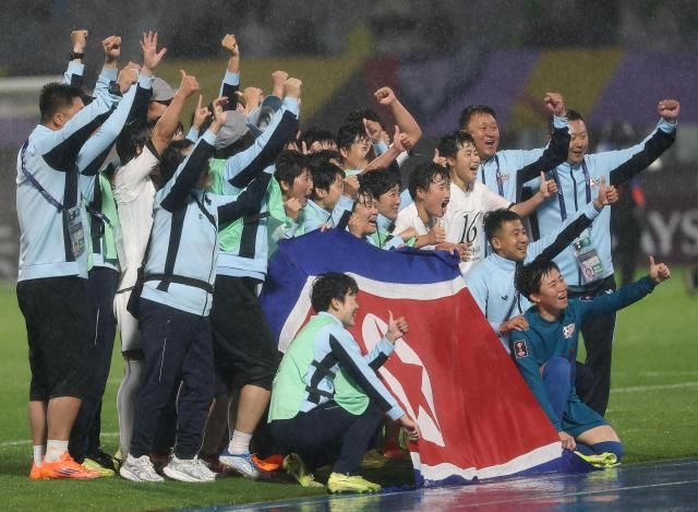 Naegohyang Women’s Football Club players celebrate with a North Korean flag after defeating Suwon FC Women in the semifinals of the Asian Football Confederation Women’s Champions League in Suwon on May 20 2026 Yonhap