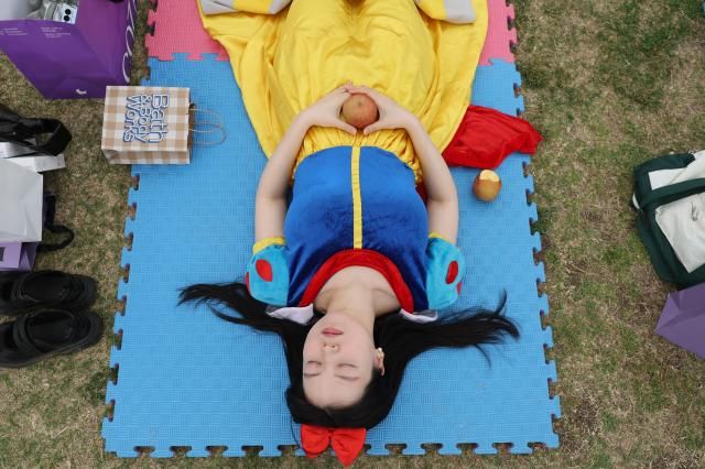 A participant Nam Ji-soo sleeps at the 2026 Han River Napping Championship held at Mulbit Plaza in Yeouido Hangang Park Yeongdeungpo-gu Seoul May 2 2026 AJP Han Jun-gu