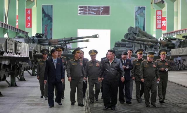 North Korean leader Kim Jong-un center inspects a munitions factory at an undisclosed location in Pyongyang on May 6 2026 in this photo released by the state-run North Korean Central News Agency two days later