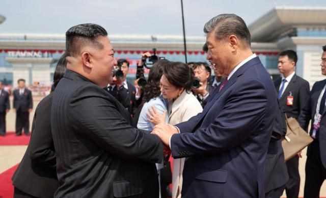 North Korean leader Kim Jong-un left shakes hands with Chinese President Xi Jinping before Xis departure at Pyongyang Sunan International Airport on June 9 2026 in this photo released by the state-run North Korean Central News Agency KCNA the following day