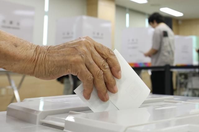 A senior citizen casts a ballot on local election day on June 3 2026 Yonhap