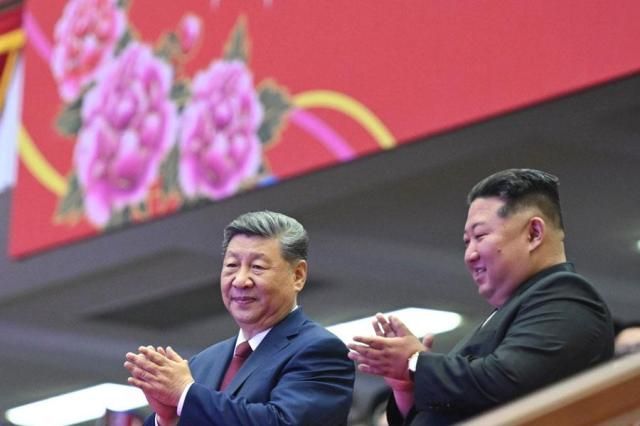 North Korean leader Kim Jong-un right and Chinese President Xi Jinping watch a performance at a gymnasium in Pyongyang on June 8 2026 Xinhua-Yonhap